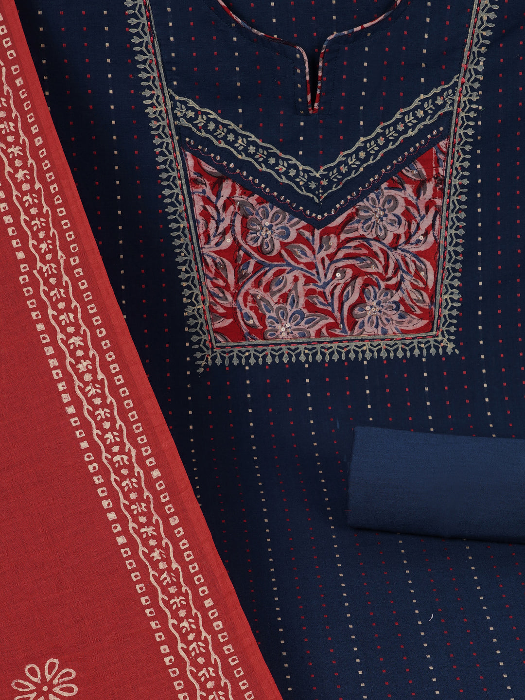 Unstitched suit set crafted in dobby fabric features a handcrafted Kalamkari printed patch.