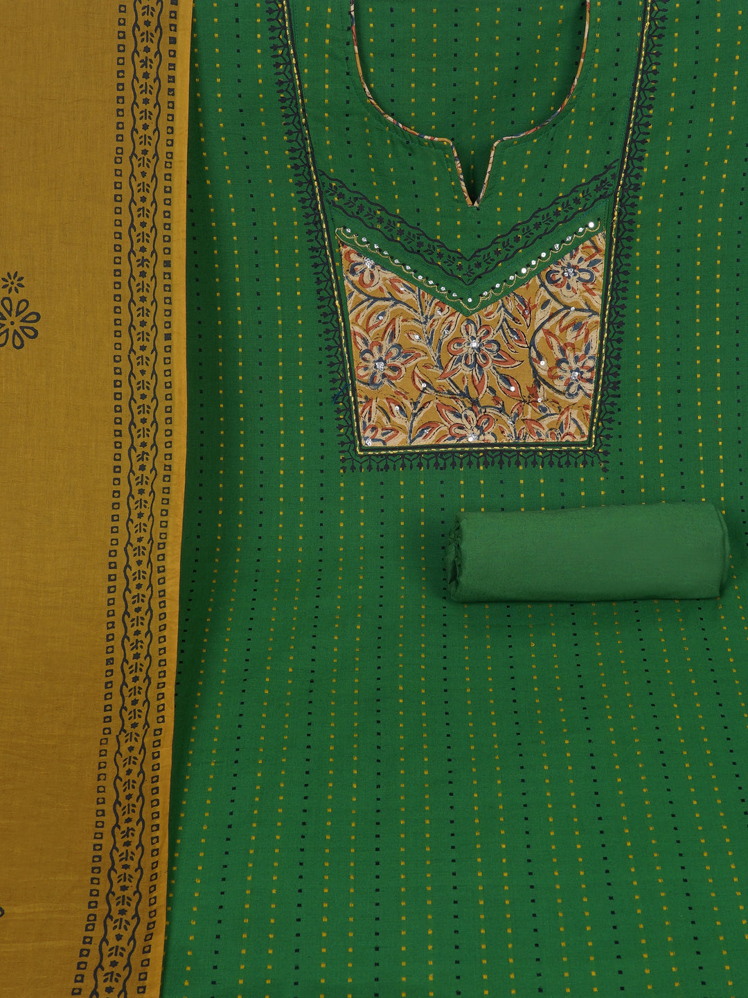 Unstitched suit set crafted in dobby fabric features a handcrafted Kalamkari printed patch.