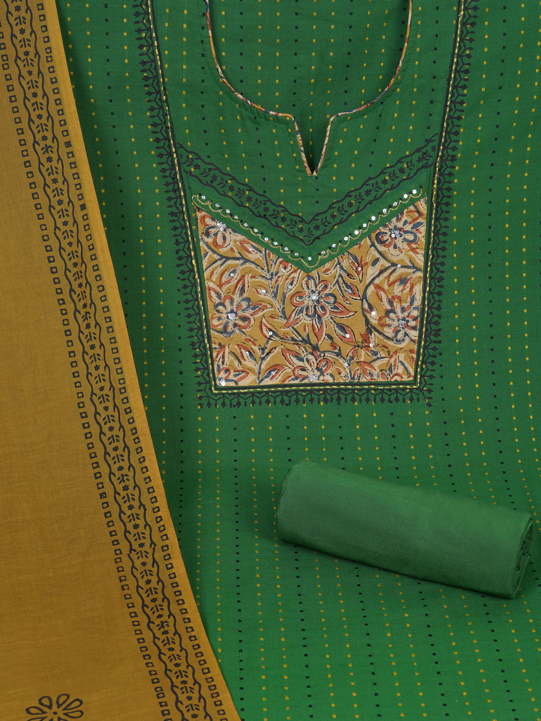 Unstitched suit set crafted in dobby fabric features a handcrafted Kalamkari printed patch.