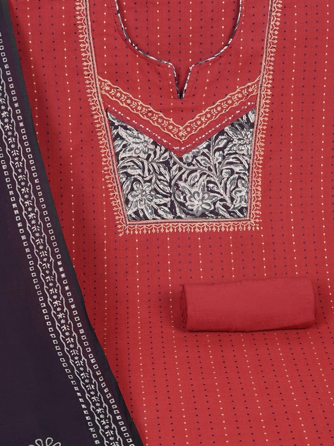 Unstitched suit set crafted in dobby fabric features a handcrafted Kalamkari printed patch.