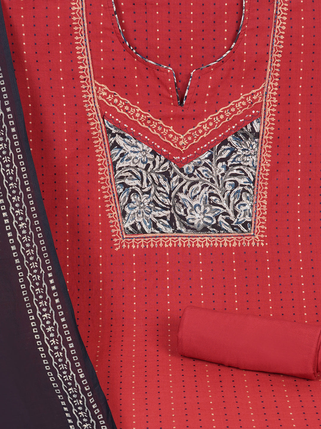 Unstitched suit set crafted in dobby fabric features a handcrafted Kalamkari printed patch.