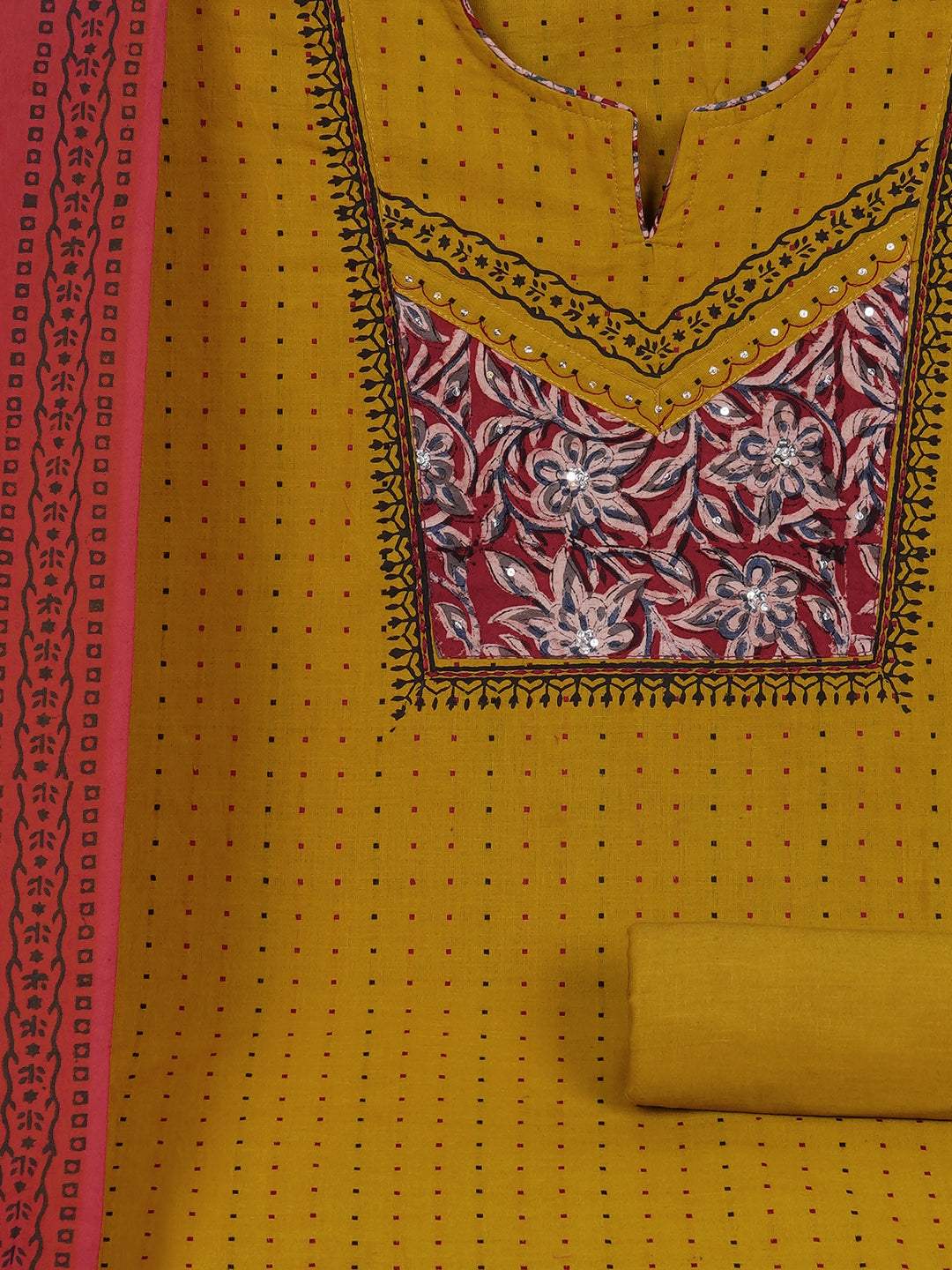 Unstitched suit set crafted in dobby fabric features a handcrafted Kalamkari printed patch.