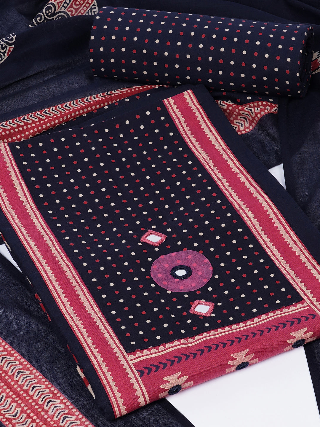 Unstitched suit set featuring a contrast yoke crafted in block print fabric and delicate handwork.