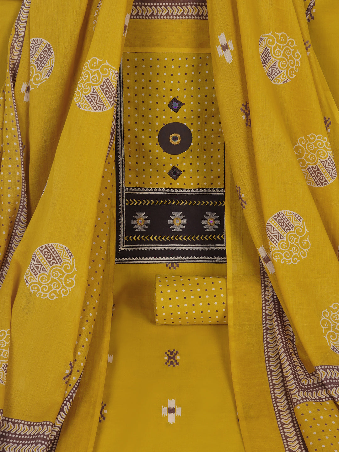Unstitched suit set featuring a contrast yoke crafted in block print fabric and delicate handwork.