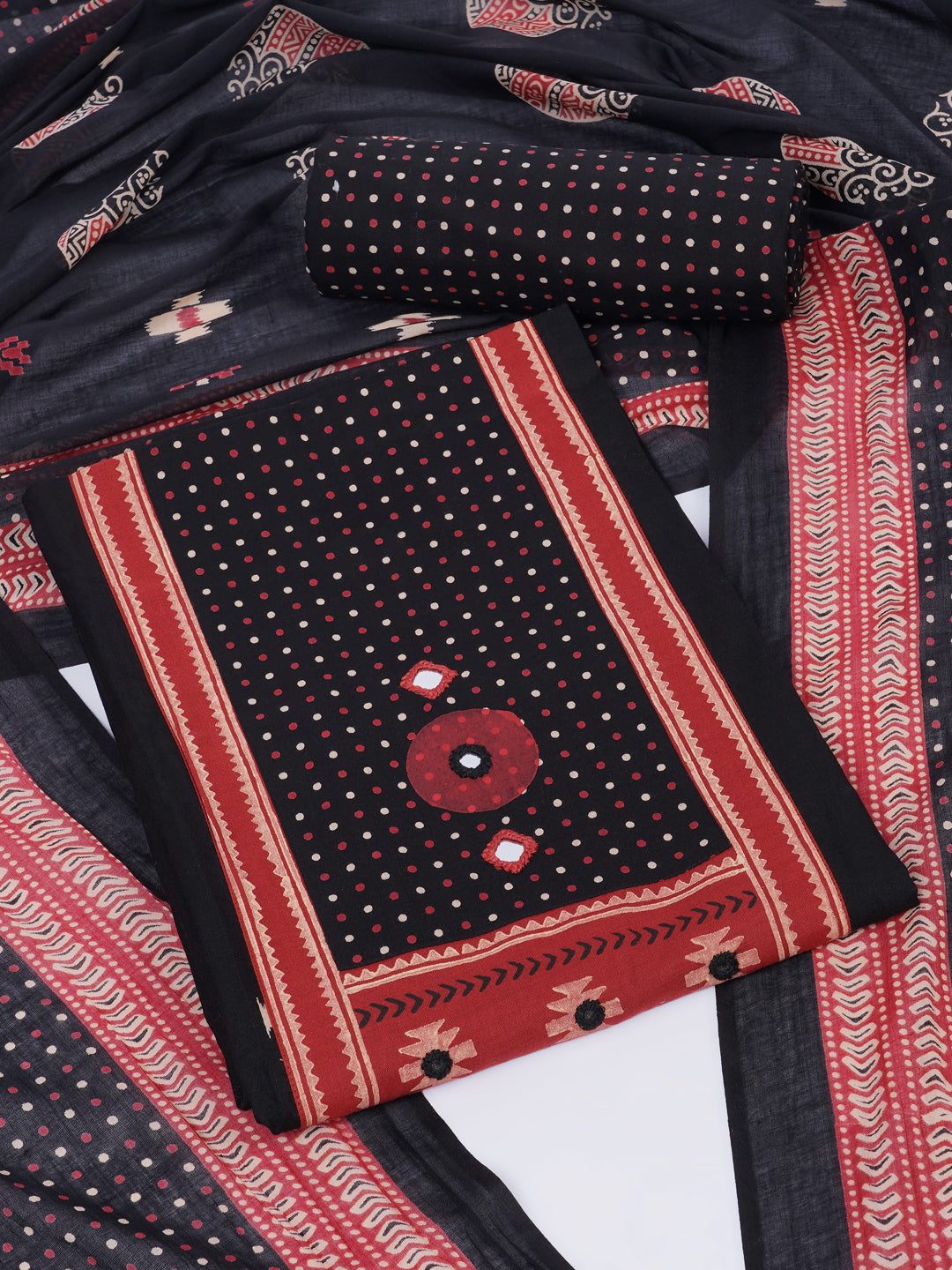 Unstitched suit set featuring a contrast yoke crafted in block print fabric and delicate handwork.