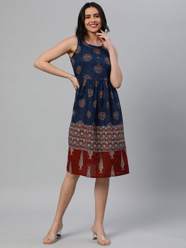 Khoobsurat - A sleeveless dress gathered at wiast with contrasting print fabrics at hemline.