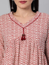 Flared cotton top with gathering details and tassels.(Maroon)