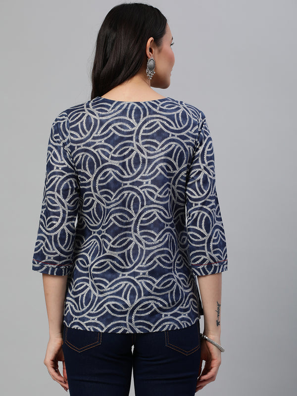 Khoobsurat - A printed tunic with a yoke detail embellished with metal trim.