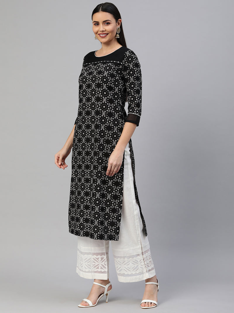 Straight fit cotton printed kurta with handwork detailing.